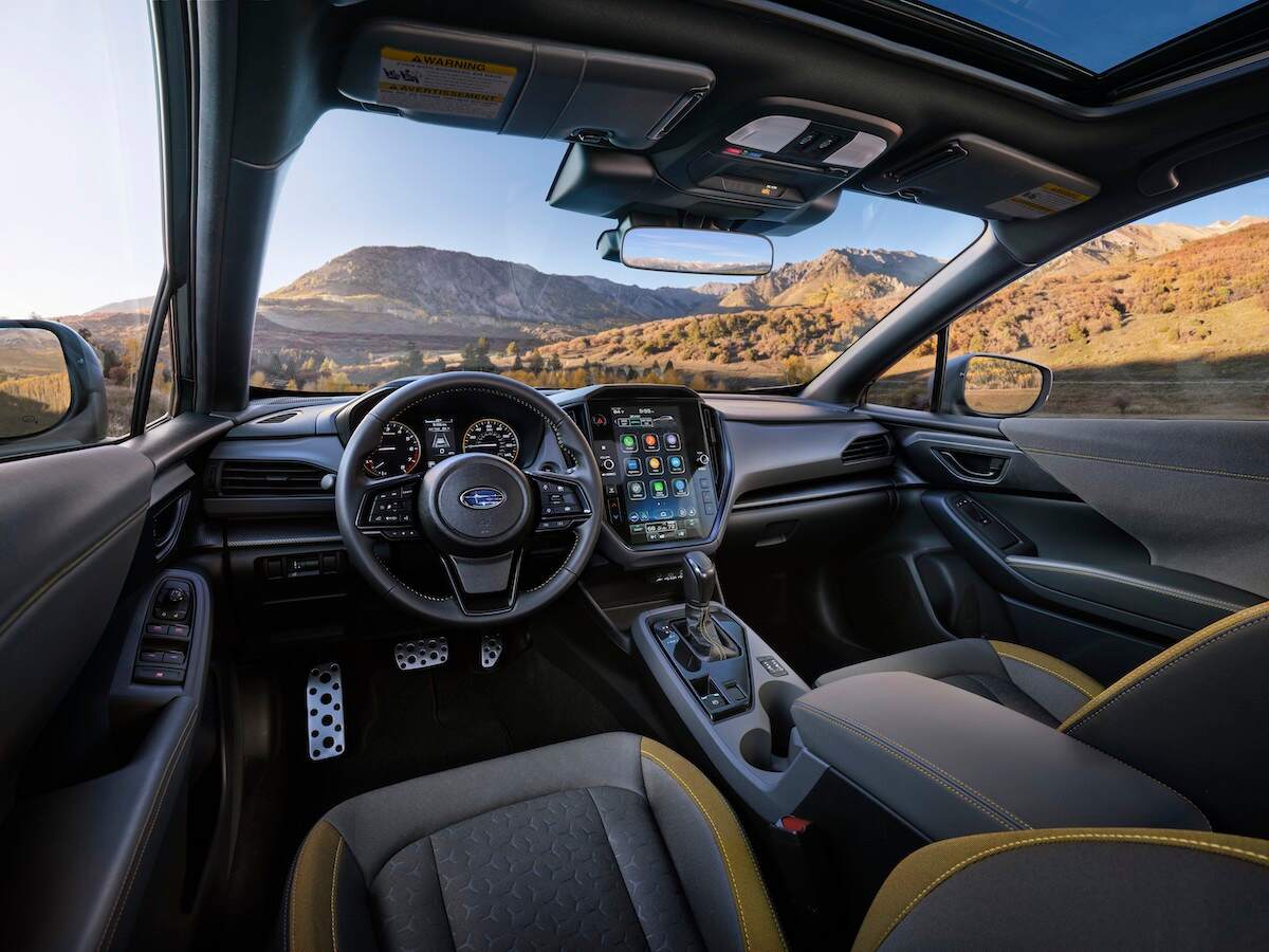2024 Subaru Crosstrek Sport cockpit, looking out onto mountains on a sunny day