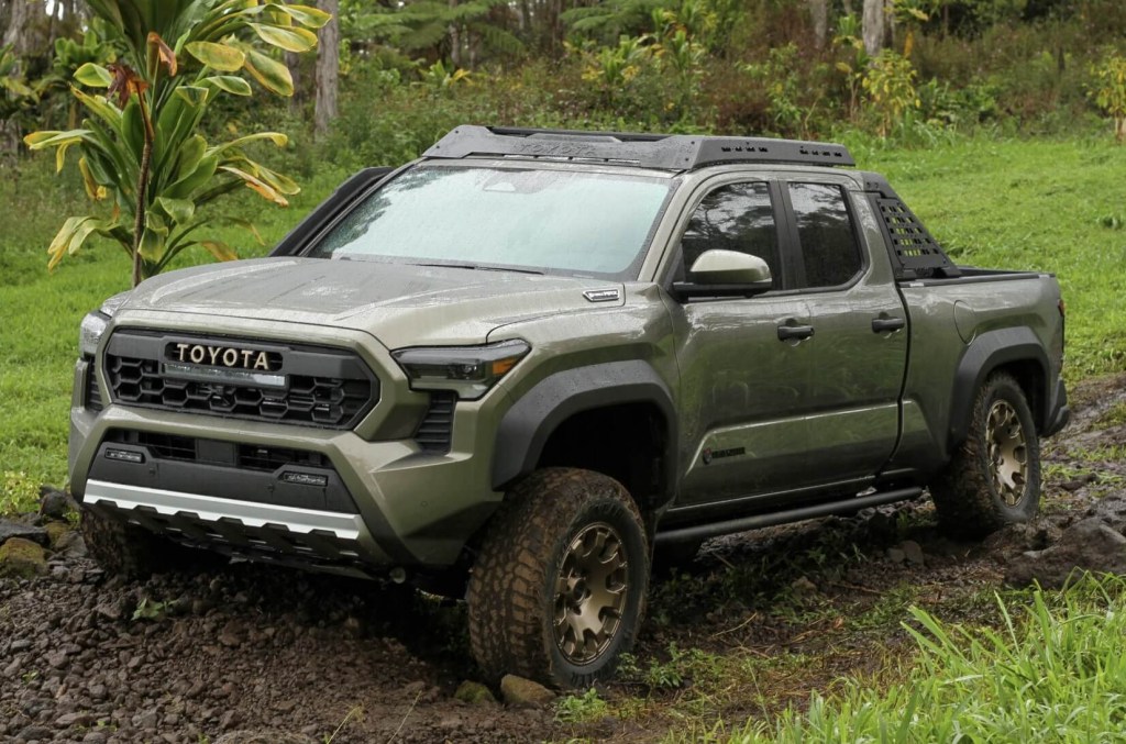The 2024 Toyota Tacoma Hybrid off-roading in the mud 