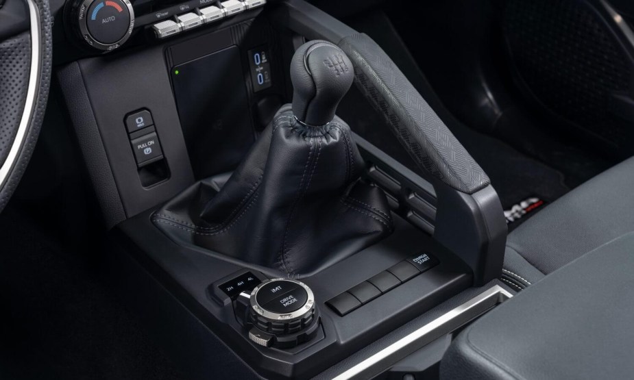 The gearshift lever in a 2024 Toyota Tacoma manual transmission pickup truck.