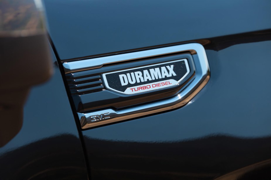 Closeup of the Duramax Turbo Diesel badge on a GMC Sierra 1500, one of the most efficient pickup trucks for towing.