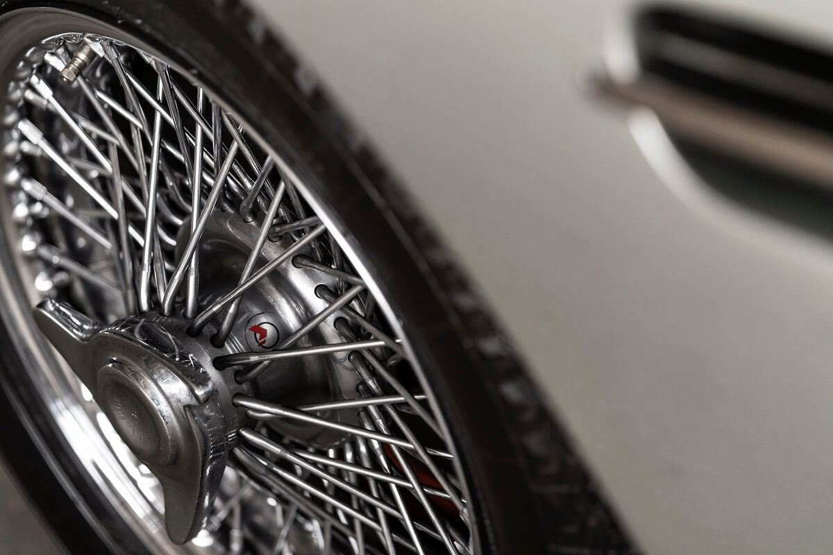 A DB5 shows off its wire wheels and silver paintwork.