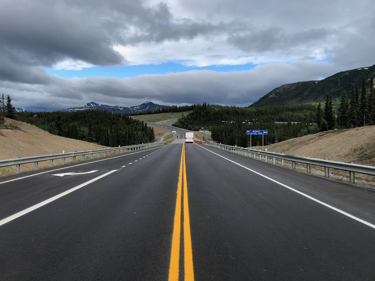 A lonesome two-lane highway cuts through Denali National Park in Alaska. 