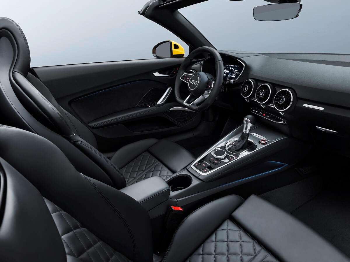 An Audi interior with quilted seats.
