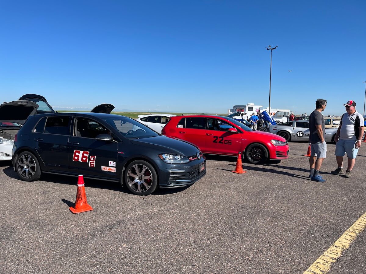 A couple of Volkswagen GTIs in the pits at an autocross race