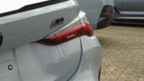 M4 Series Competition rear badging on a gray BMW 4 Series model in North Rhine-Westphalia, Cologne, Germany