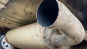 A car exhaust pipe without a silencer attached.
