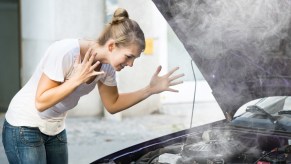 A smoking car due to overheating engine