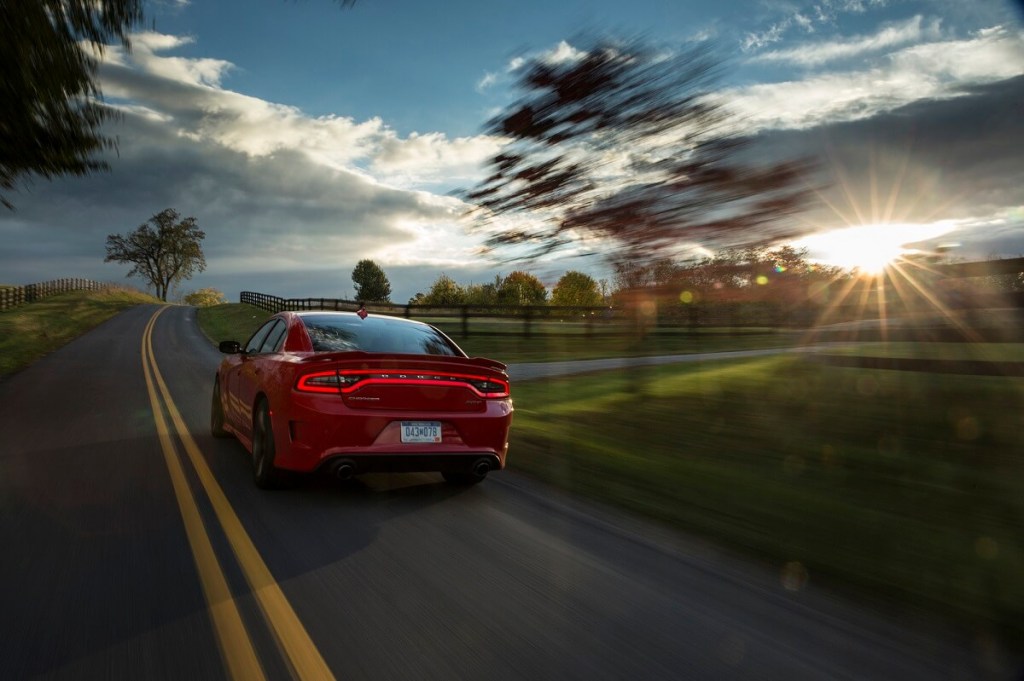 A used 2016 Dodge Charger SRT Hellcat cruises down back streets. 