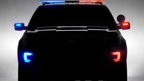The silhouette of an unmarked Ford Interceptor police car.
