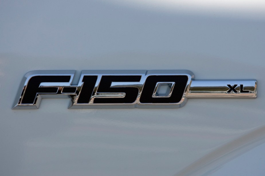 Closeup of the chrome badge of an F-150 XL trim pickup truck.