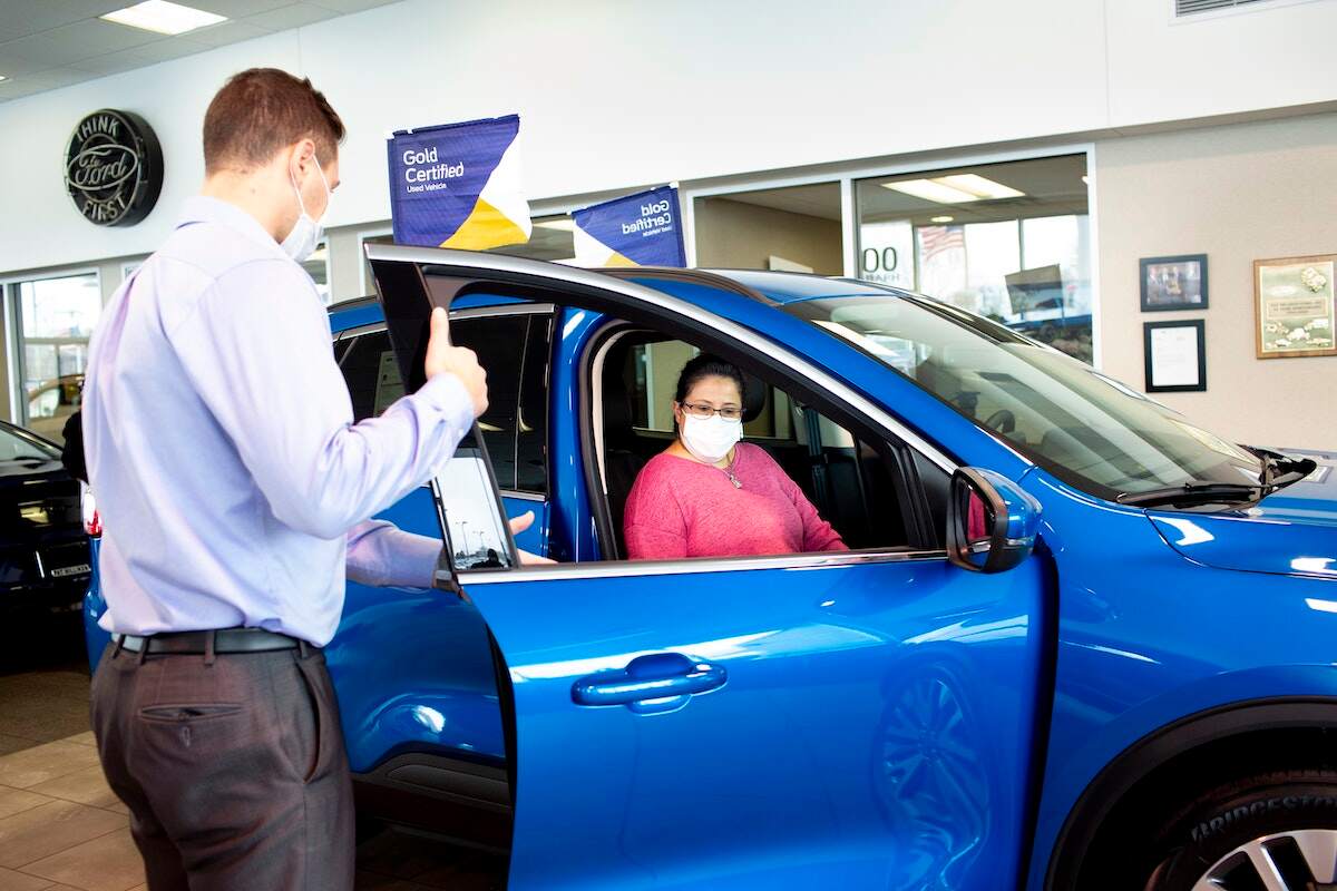 A certified pre-owned vehicle in a Ford showroom