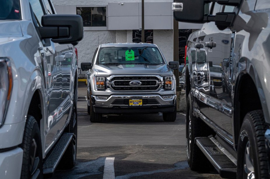 A silver 2023 Ford F-150 parked at a dealership.