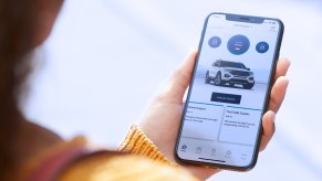 A person using FordPass on their phone