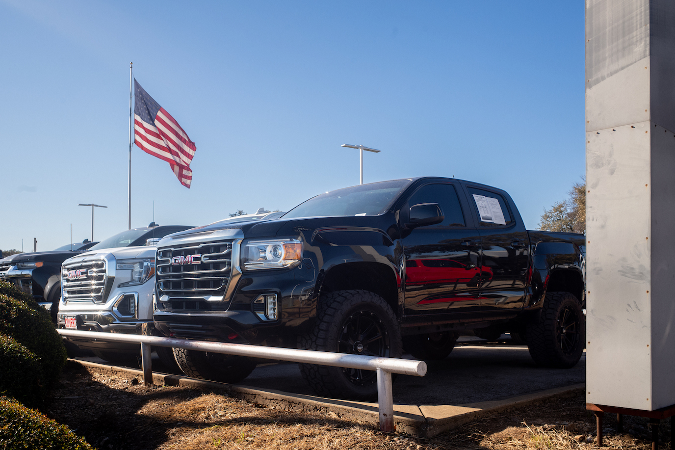 GMC pickup trucks are displayed for sale on a lot at a General Motors dealership. GM trucks are facing sales stagnation