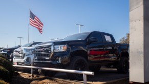 GMC pickup trucks are displayed for sale on a lot at a General Motors dealership. GM trucks are facing sales stagnation