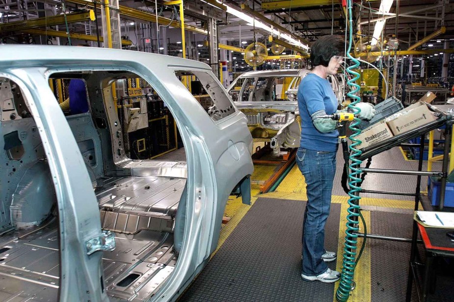 A GM factory assembles a unibody SUV.