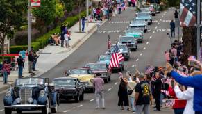 Classic car parade similar to what you'd find at the Sarasota Classic Car Museum