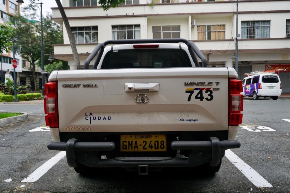 The tailgate of a white Great Wall "Wingle 7" compact pickup truck in Ecuador.