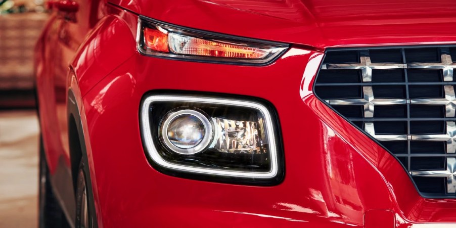The front of a red 2023 Hyundai Venue subcompact SUV.