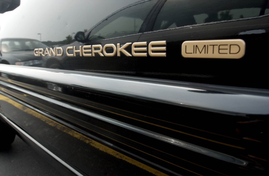 Closeup of a Jeep Grand Cherokee limited badge on a car named after a tribe.