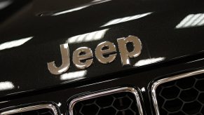 Closeup of the logo of a Jeep that is not American-made, but assembled in Italy instead.