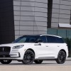 Of Lincoln sales in 2023, the new 2023 Lincoln Corsair (in white in front of a building) is on the decline while the Navigator is rising.