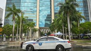 A police car equipped with a push bumper sits in front of the Wilkie D. Ferguson Jr. United States Federal Courthouse in Miami