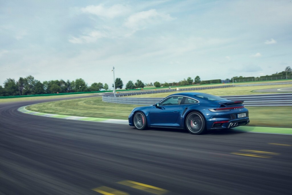 A 992 Porsche 911 Turbo takes a corner with speeds that make it an alternative to a 2023 Chevrolet Corvette Z06. 
