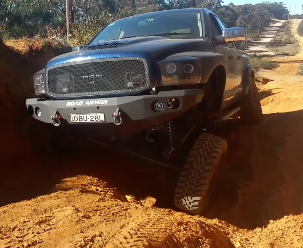Ram pickup truck off-roading with crazy axle articulation