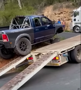 Ram Pickup Truck Saves Tow Truck But Not Before Monster Trucking Over It