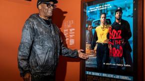 Spike Lee celebrating John Singleton with an original poster for 'Boyz N The Hood,' which popularized lowriders