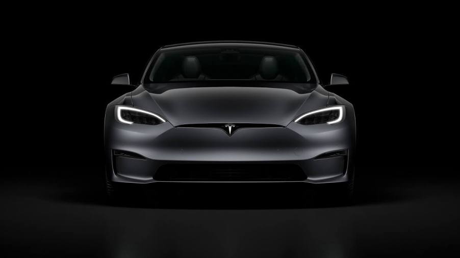 A Tesla Model S flashes its running lights.