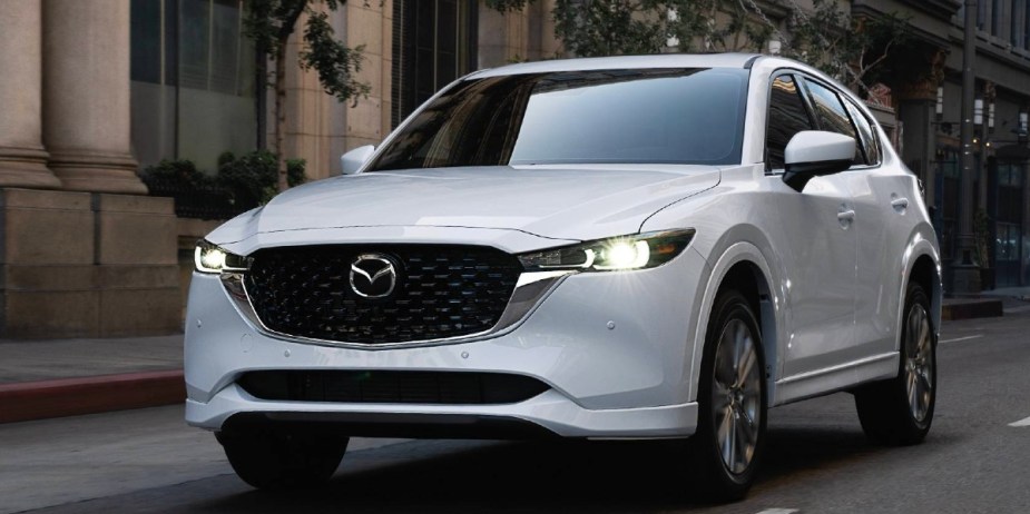 A white 2023 Mazda CX-5 small SUV is parked.