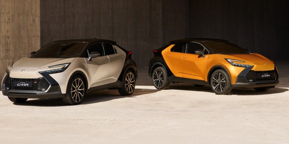 Two Toyota C-HR subcompact SUVs are parked. 