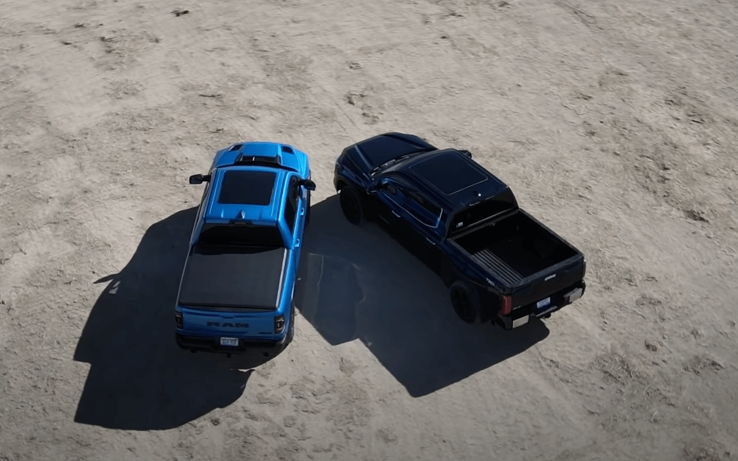 Bird's eye view of a Ram 1500 and Toyota Tundra Limited parked side-by-side.