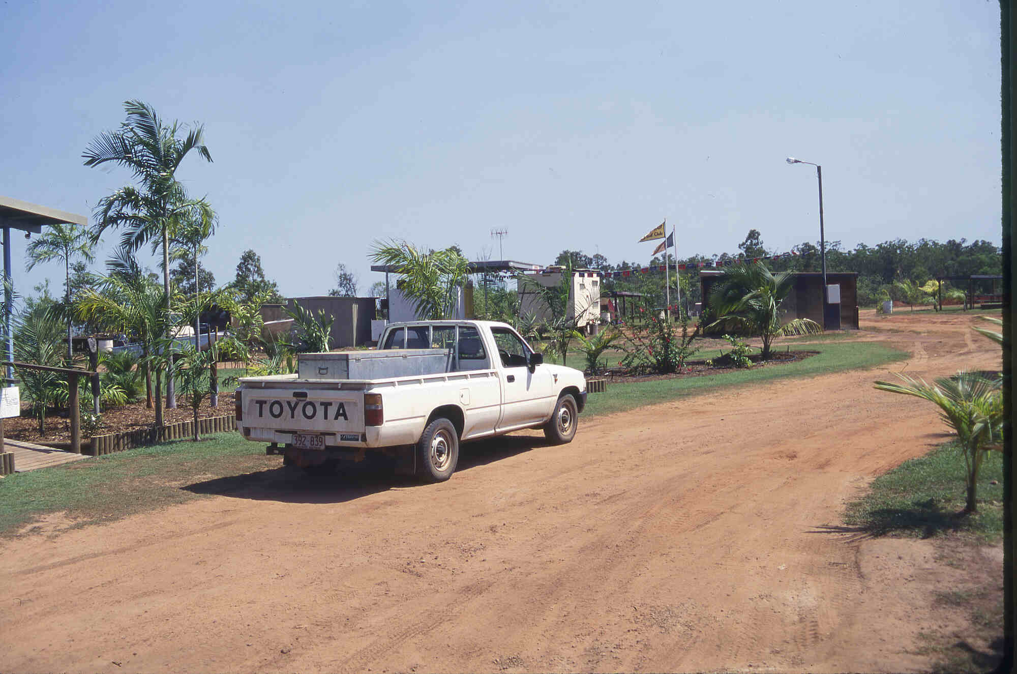 A used Toyota pickup truck parked on a dirt road