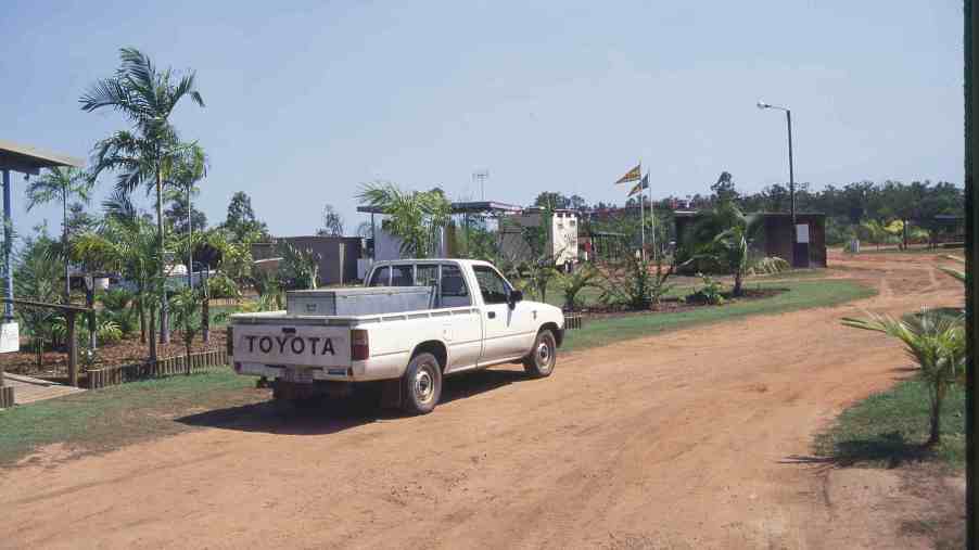 A used Toyota pickup truck parked on a dirt road