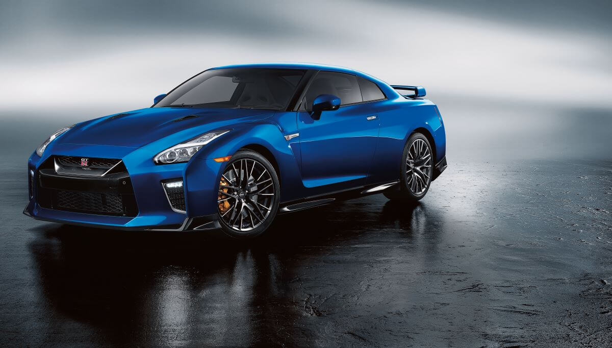 A promotional shot of a blue 2023 Nissan GT-R performance sports car coupe model