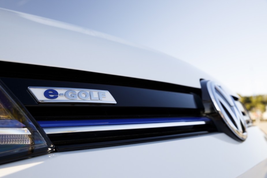 The e-Golf badge on a white electric Volkswagen Golf hatchback