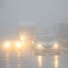 Fog reducing visibility on a road in Edirne, Turkey, as cars navigate with headlights and fog lights