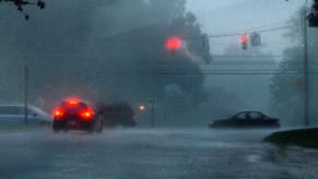Cars hydroplaning in an intersection at Route 108 in Olney, Maryland, due to rain and floods