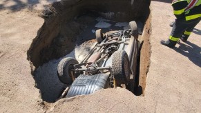 Jeep Grand Cherokee upside down inside of sinkhole | Colorado State Police