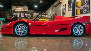 Red Ferrari F50 with reflection on smooth floor in Marconi Automotive Museum