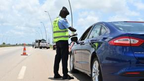 A police checkpoint for driver's license near Grand Bassam in Abidjan, Côte d’Ivoire, West Africa