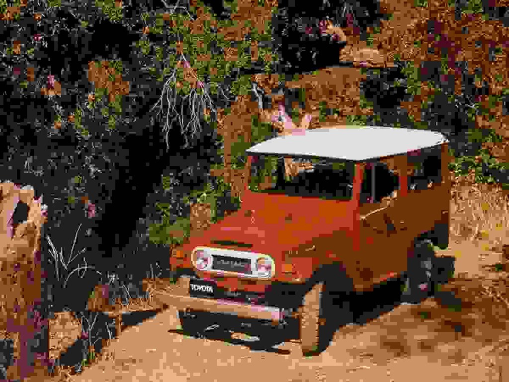 Red 1973 Toyota FJ40 Land Cruiser front 3/4 view