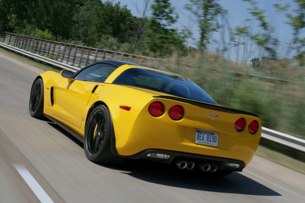 A bright-yellow 2013 Chevrolet Corvette Z06 with over 500 horsepower blasts down a back road.