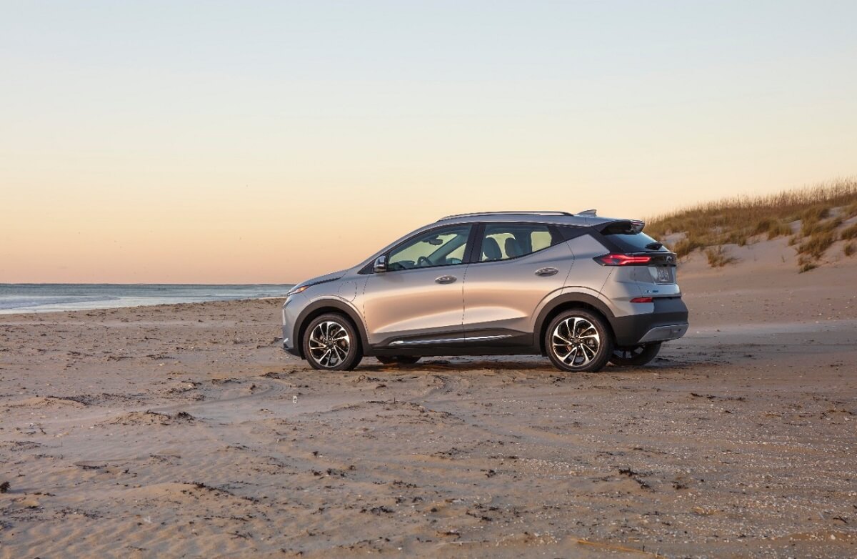 A Chevrolet Bolt EUV parks on the sand.