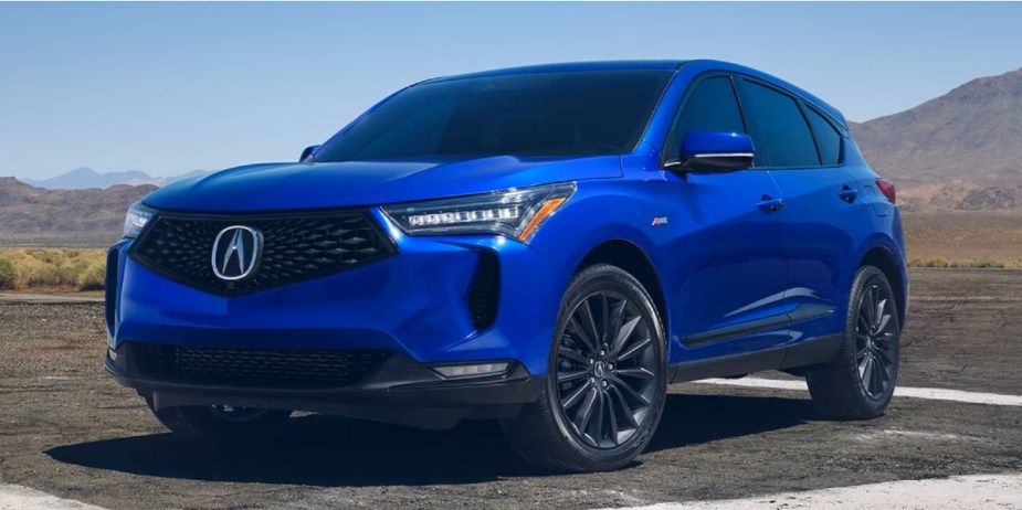 A blue 2023 Acura RDX small luxury SUV is parked. 