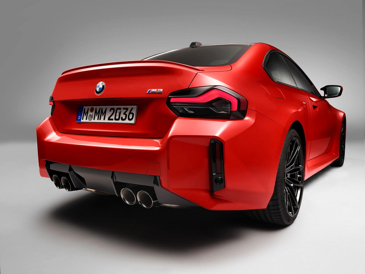 An orange 2023 BMW M2 shows off its rear-end styling.