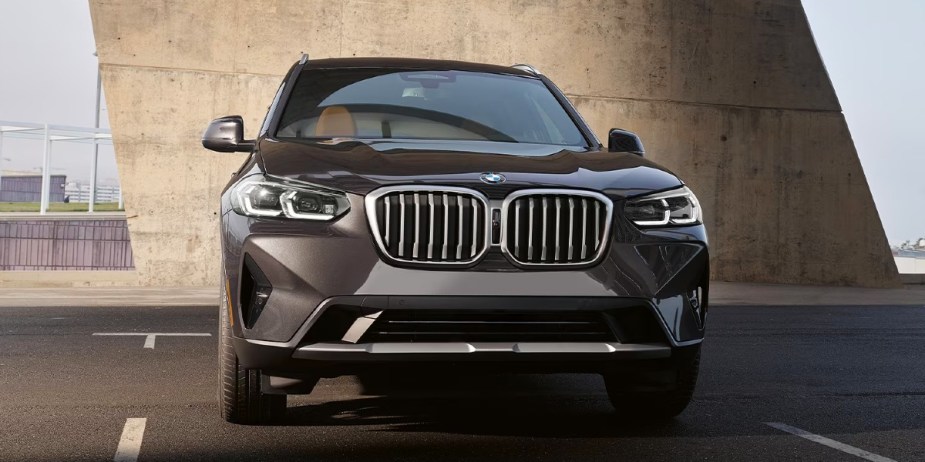 A gray 2023 BMW X3 luxury small SUV is parked, its starting price is affordable.